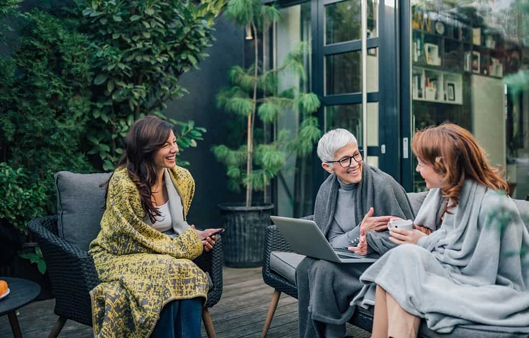 Women outside on the porch chatting