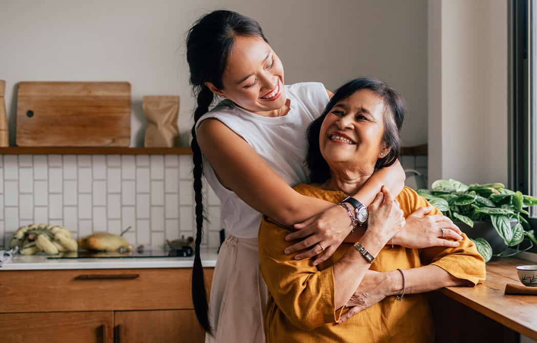 Daughter hugging mom