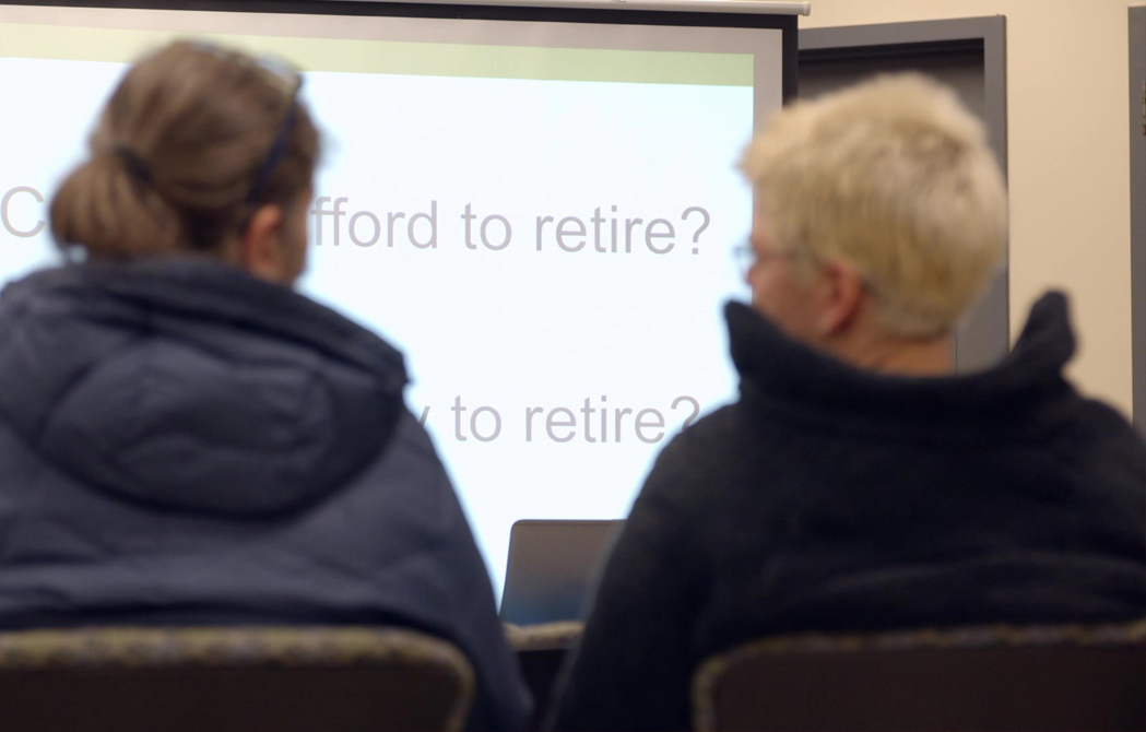 two attendees sitting and talking at an OnPoint Financial Services Seminar