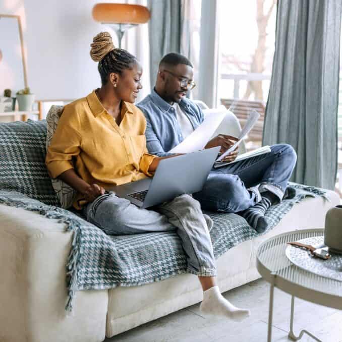 A couple going over mortgage paperwork.