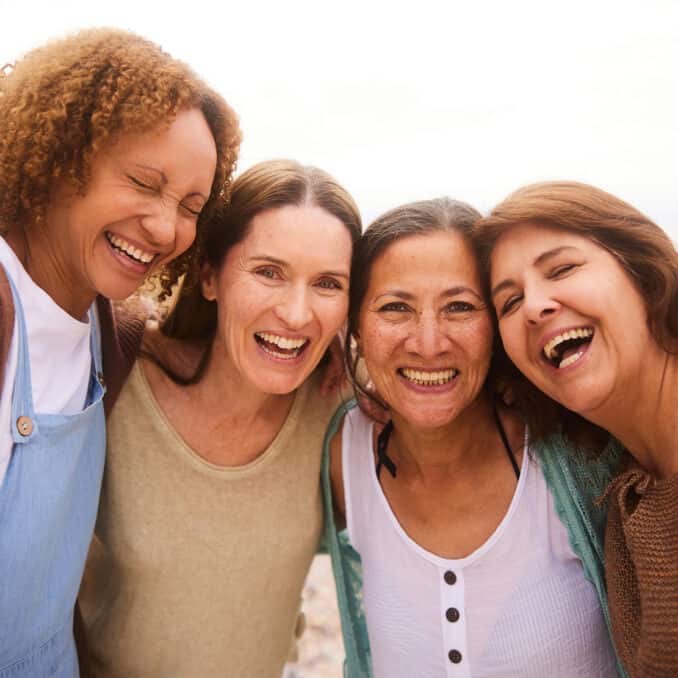 Group of middle-aged women smiling