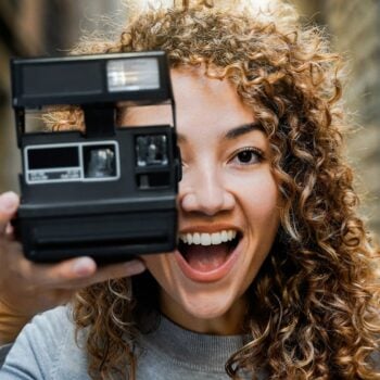 woman-holding-vintage-camera