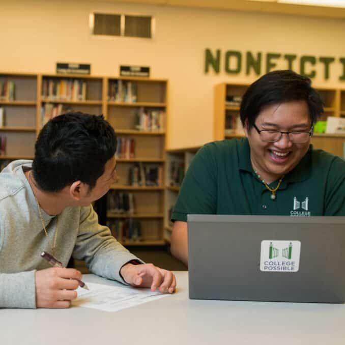 student-being-mentored-in-library