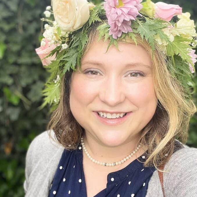 Missy-smiling-with-flowers
