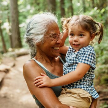 grandmother with a child in her hands