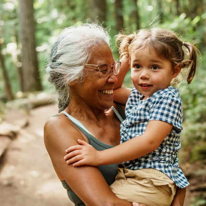 grandmother with a child in her hands