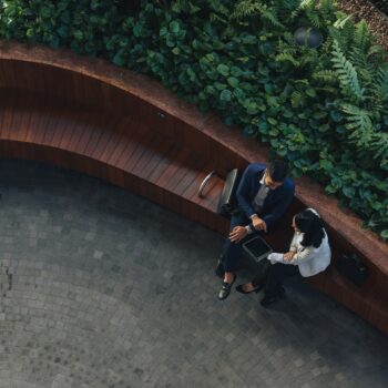 ariel-view-two-people-sitting-down-outside