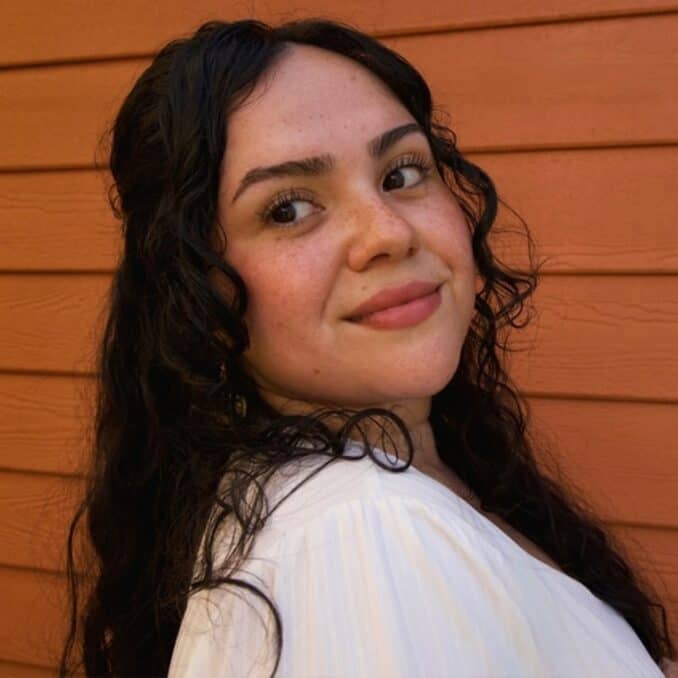 Headshot-of-Valeria-looking-over-her-shoulder