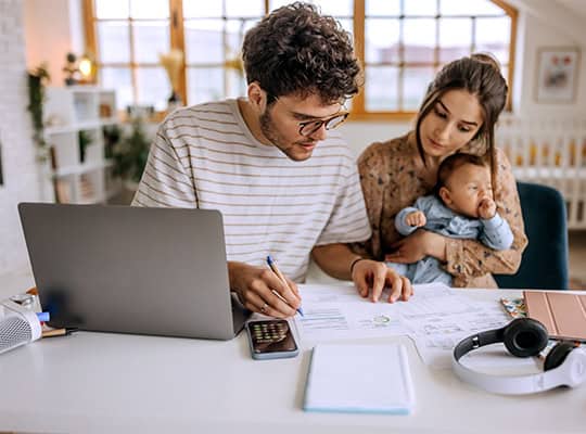 financial wellness onpoint community credit union budgeting education young couple budgeting with baby