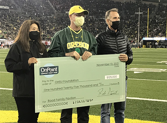 Childrens Miracle Network check presentation at Oregon Ducks football game