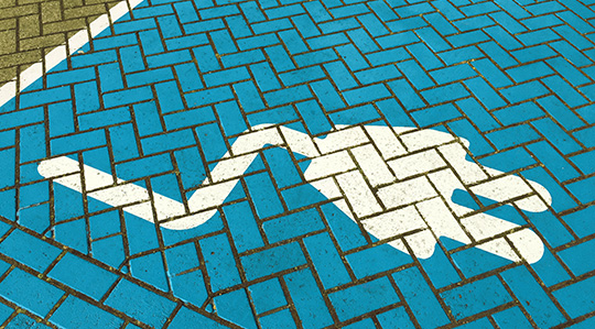 blue painted pavement with plug design