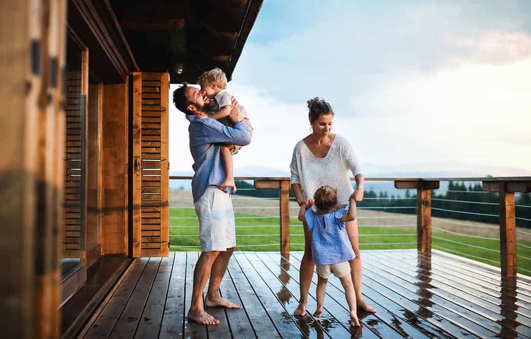 family playing with kids on new deck at pacific northwest style house onpoint heloc home equity line of credit equityflex
