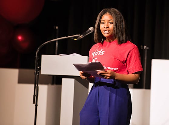 teen girl gives presentation as part of Girls Inc. involvement