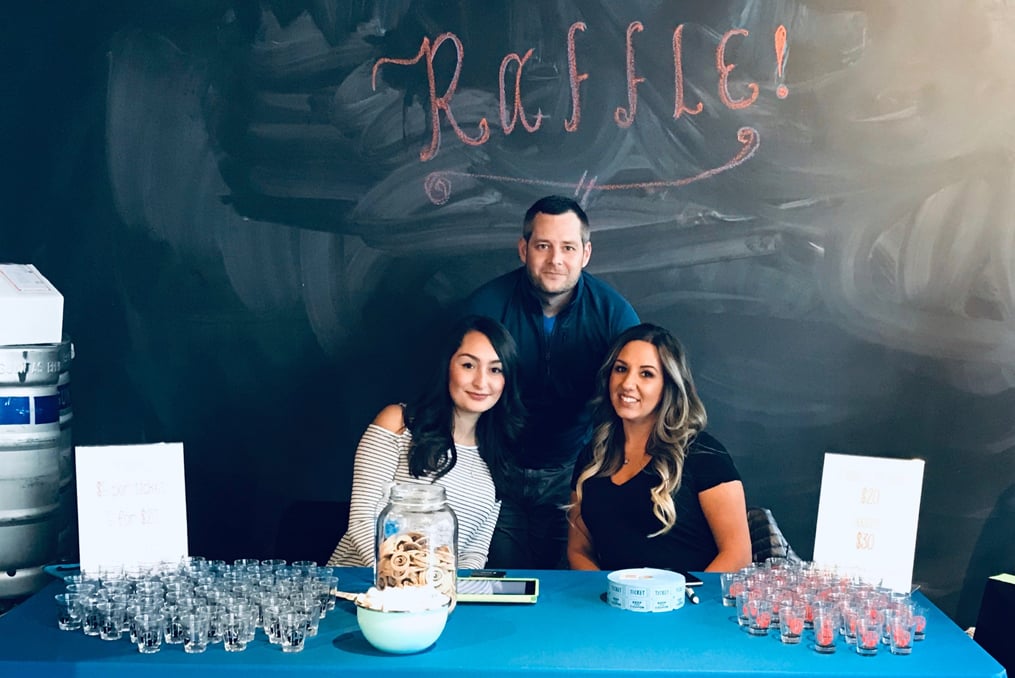 Isabel Lara_Employee Spotlight photo at Raffle with coworkers