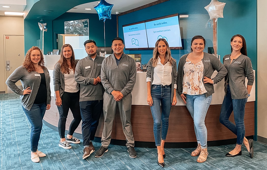 Team members of the OnPoint Johnson Creek Branch line up to celebrate the opening of their new branch.