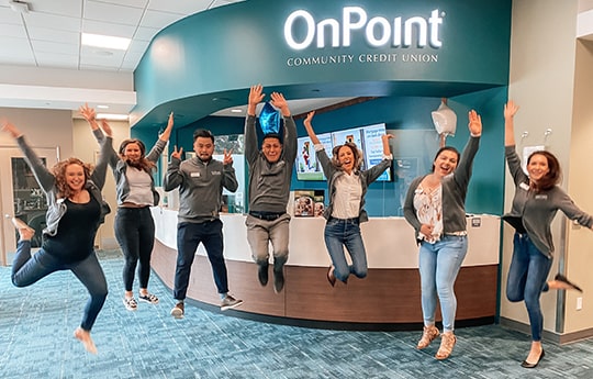 Team members of the OnPoint Johnson Creek Branch line up to celebrate the opening of their new branch.