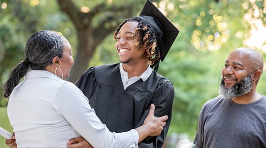 family celebrating sons graduation investment services onpoint community credit union