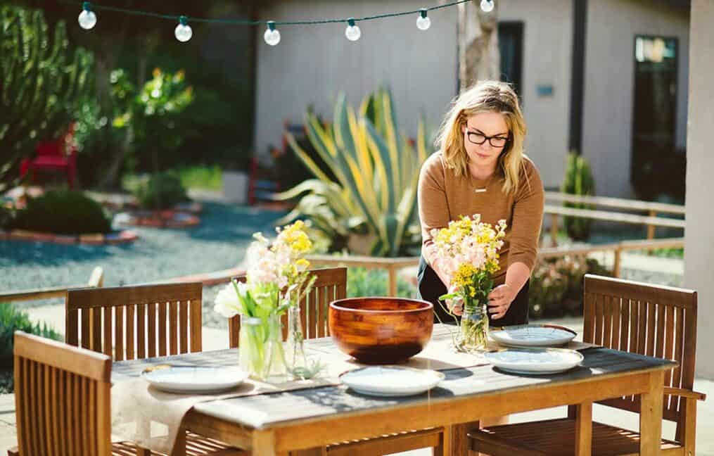 women-setting-table-outside