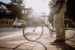 Man standing on street corner with his bike