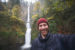 Man standing in front of Multnomah Falls