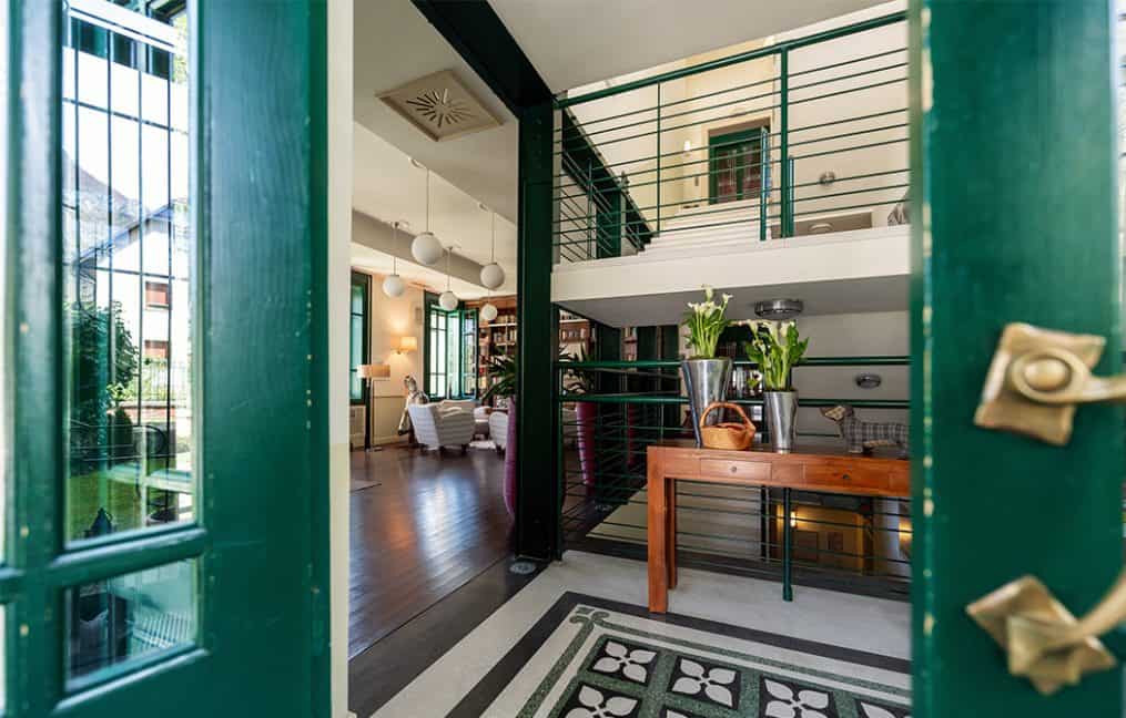 Green door open looking into home with modern decor onpoint low down payment mortgages