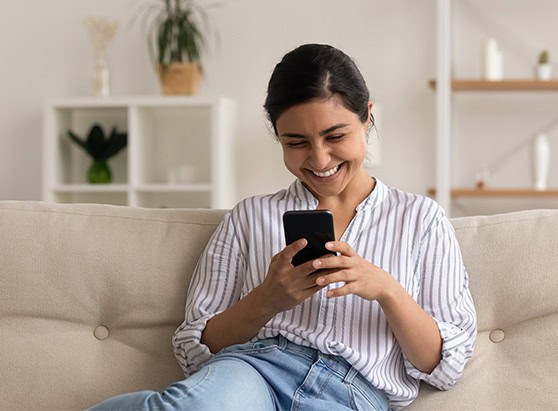 Membership appreciation onpoint rewards happy receiving reward looking at phone