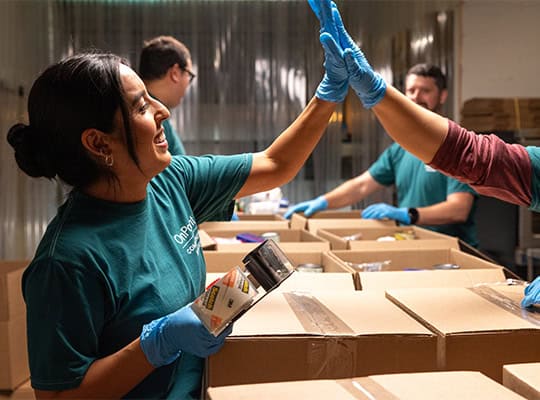 membership appreciation 2024 onpoint volunteers at food bank high fiving