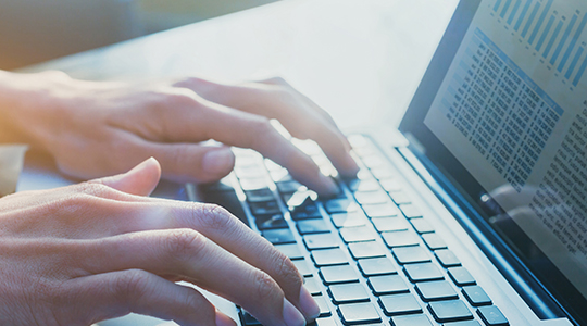 close up of hands of business person computing report results for company