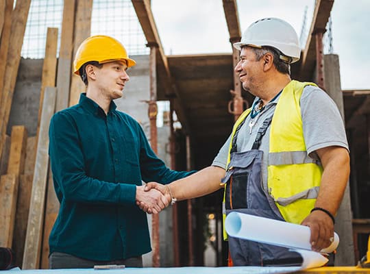 commercial loan onpoint community credit union construction site shaking hands