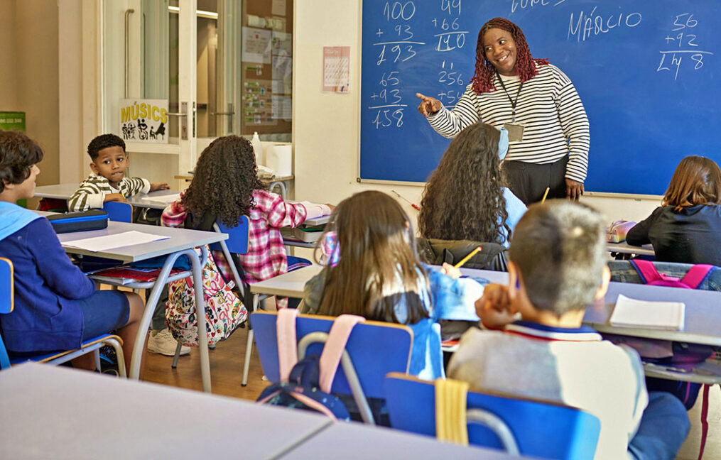 Playful Teacher Calling on Young Student in Math Class