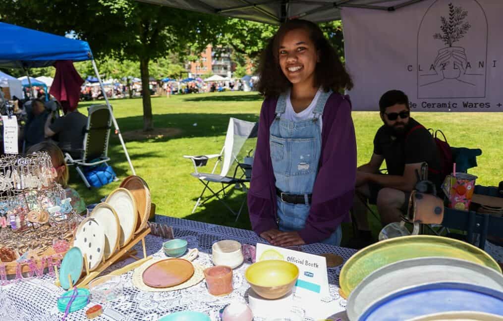 young-girl-smiling-at-booth