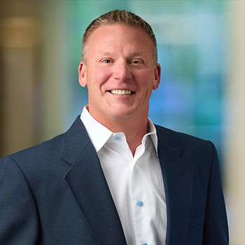 Trevor Reink OnPoint Mortgage Professional Headshot Bank Back drop