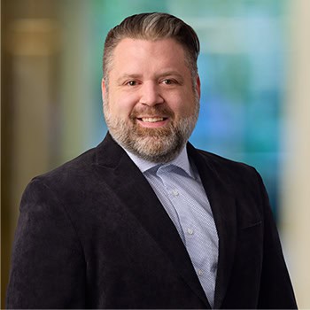 Adam Rousse OnPoint Mortgage Professional Headshot Bank Back drop
