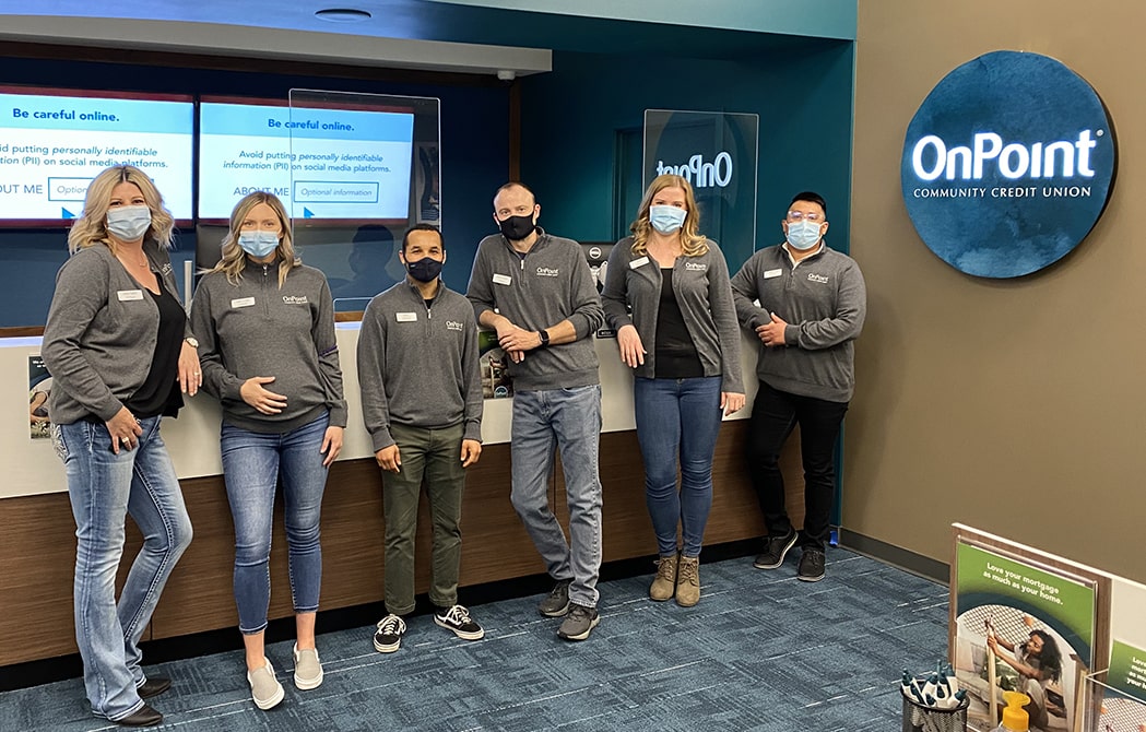 Team members of the OnPoint Salmon Creek Branch line up to celebrate the opening of their new branch.