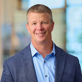 Kevin Schmidt OnPoint Mortgage Professional Headshot Bank Back drop