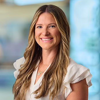 Sasia Schumacher OnPoint Mortgage Professional Headshot Bank Back drop