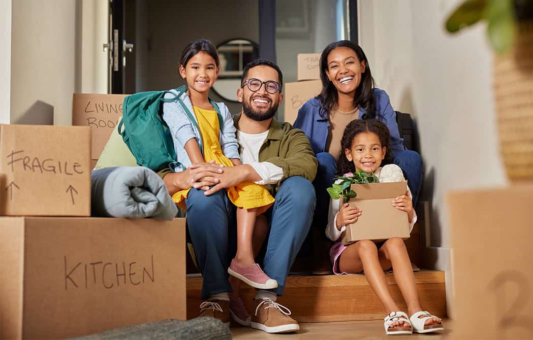 happy family moving into new home with kids