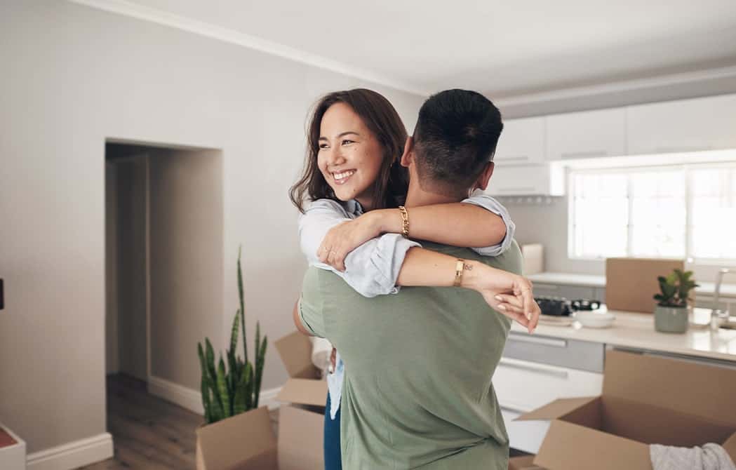 _young-couple-hugging-in-new-home