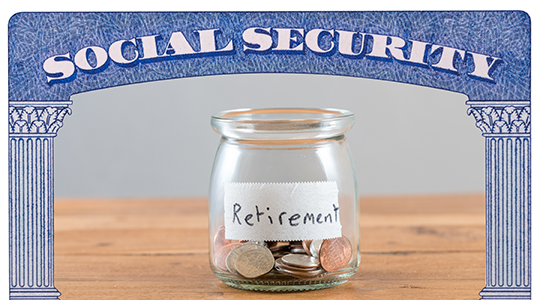 Loose change inside glass jar to represent retirement savings for Social Security