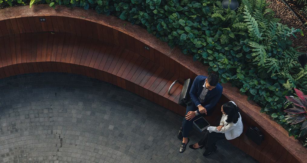ariel-view-two-people-sitting-down-outside