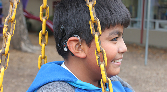 kid on swing