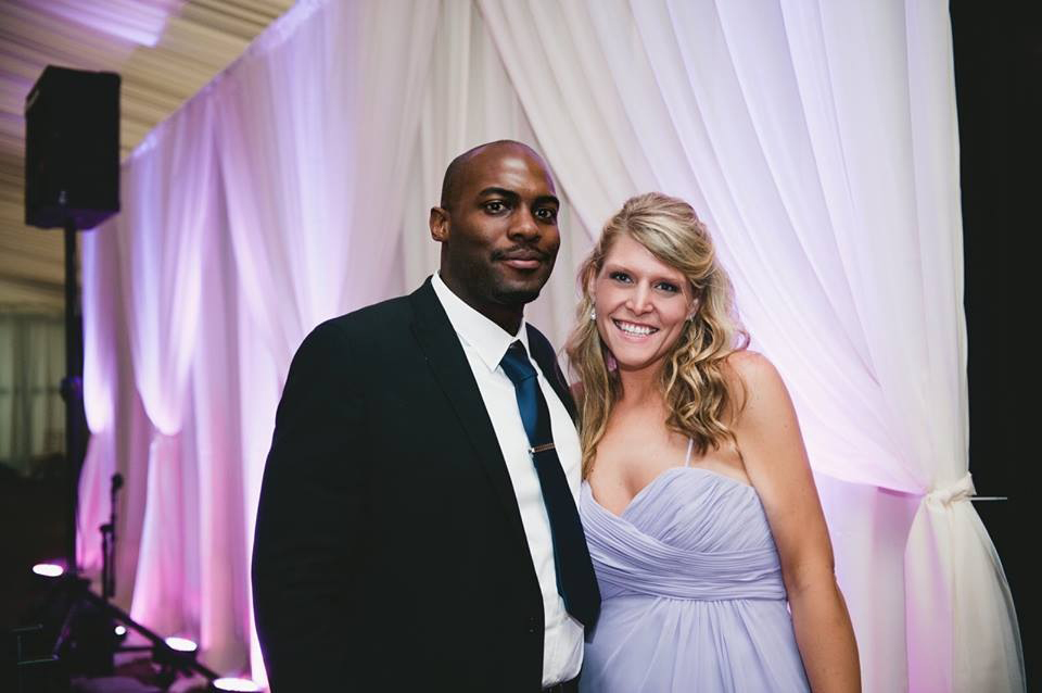 Alex Fischer with her husband at a wedding