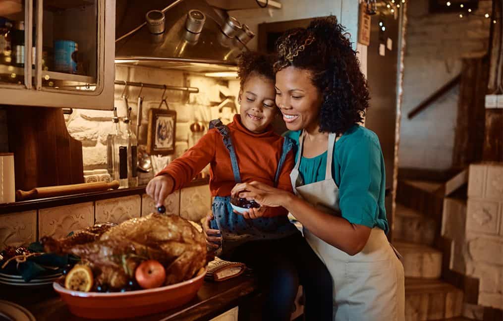 mother and daughter in kitchen making turkey onpoint winter skip pay 2025 2026