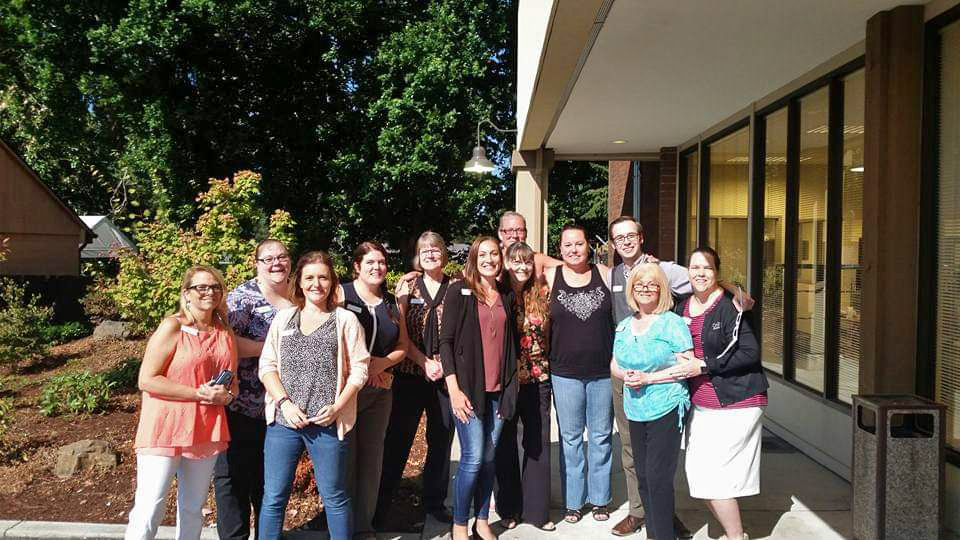 amanda and her coworkers outside of the branch