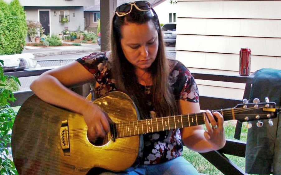 Amanda playing the guitar