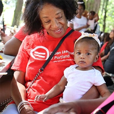 volunteer holding baby