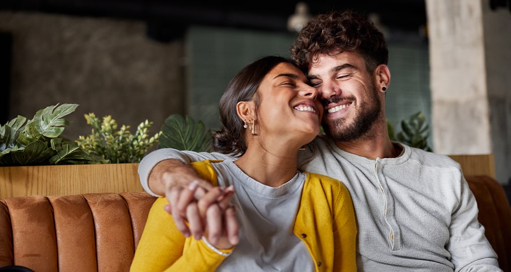 Beautiful couple embracing with great affection