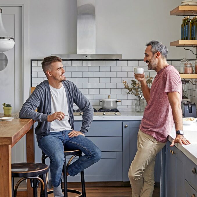 10 things your kids do not want when you downsize-father and son talking in the kitchen
