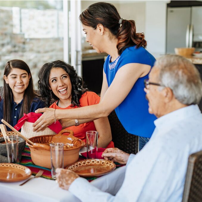 Hispanic family eating dinner