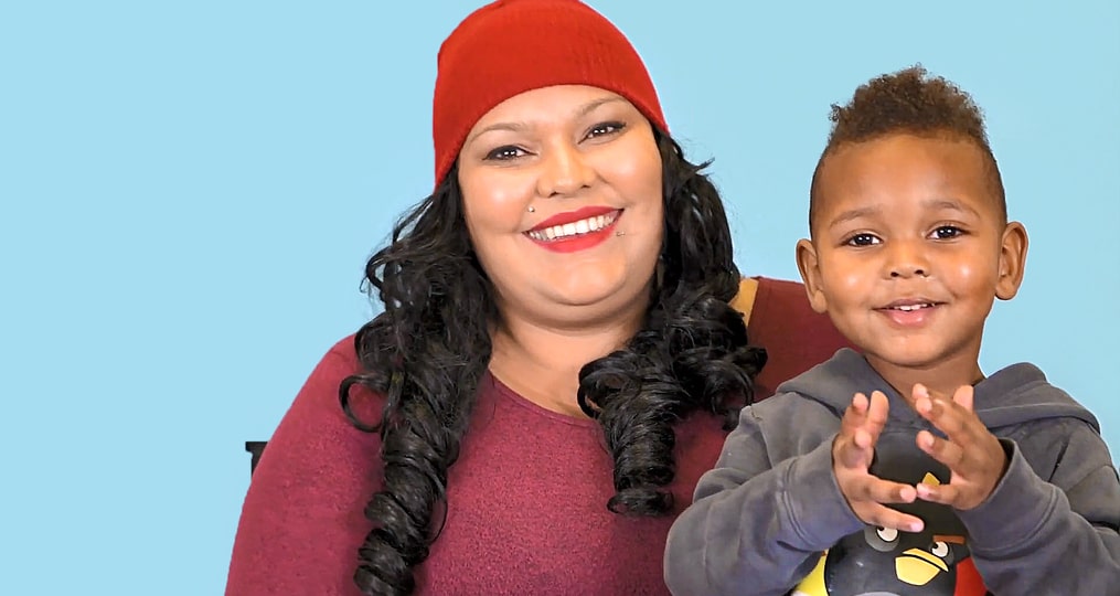 Giving Tuesday Rose Haven Feature-woman and her son on blue background sharing their story video